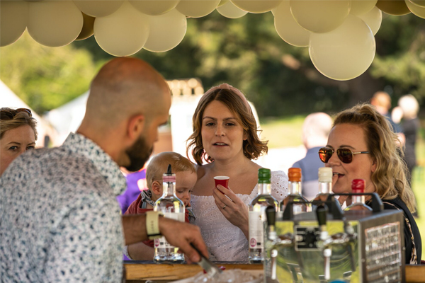 Wedding guests at a tipi bar